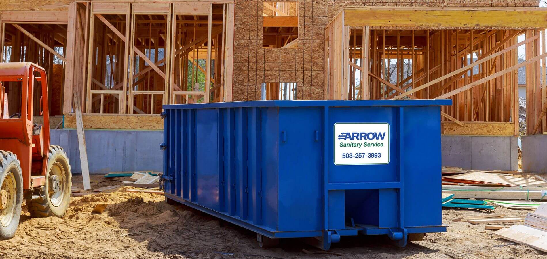 Arrow Sanitary Service roll off bin at construction site.
